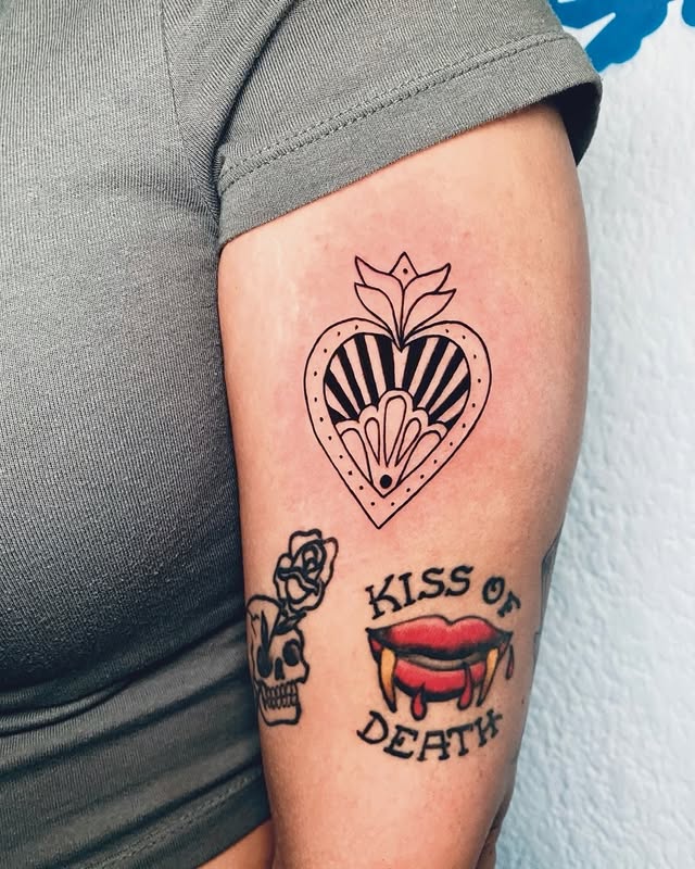 Sacred heart with stripes and floral tattoo