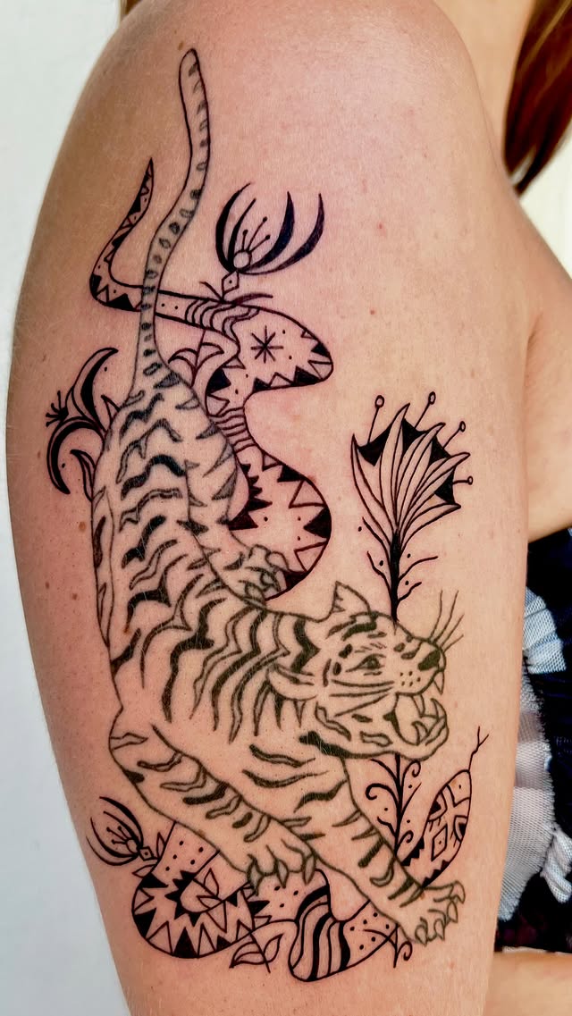 Large detailed tiger and snake arm tattoo